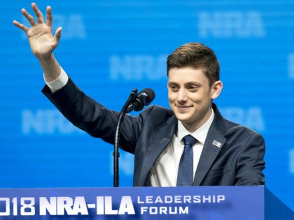 Kyle Kashuv, a student from Stoneman Douglas High School, waves as he arrives to speak at the National Rifle Association Institute for Legislative Action (NRA-ILA) Leadership Forum during the NRA annual meeting in Dallas, Texas, U.S., on Friday, May 4, 2018. President Donald Trump delivered a strong sign of support for the …