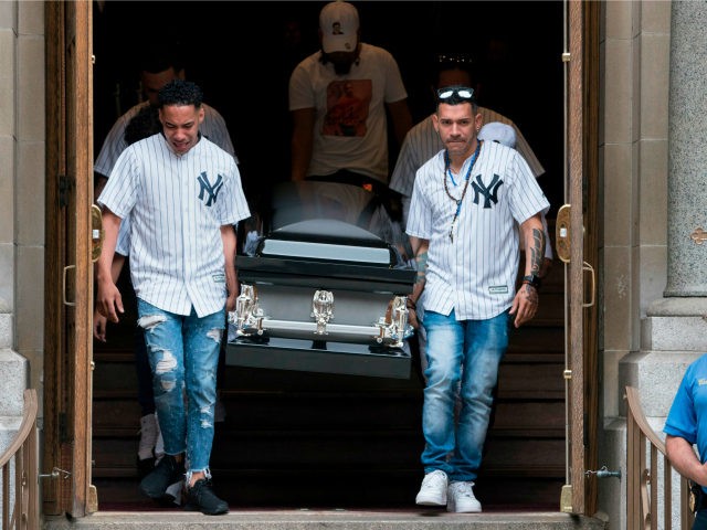 The body of Lesandro Guzman-Feliz is taken from the Our Lady of Mount Carmel church after funeral services on June 27, 2018 in New York. - Lesandro Guzman-Feliz, 15, was stabbed to death outside a Bronx bodega in an apparent case of mistaken identity. (Photo by Don EMMERT / AFP) …