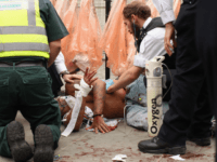 London knife crime LONDON, ENGLAND - AUGUST 29: A man is given emergency medical treatment by police officers and paramedics after being stabbed in the stomach at the Notting Hill Carnival on August 29, 2011 in London, England. The annual carnival, which is the largest of its kind in Europe and is expected …
