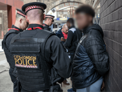LONDON, ENGLAND - JULY 12: (EDITORS NOTE: Part of this image has been pixellated to obscure identity) Suspects are detained and searched by police officers after being arrested for alleged possession of a dangerous weapon near Elephant and Castle Station during Operation Sceptre on July 12, 2017 in London, England. …