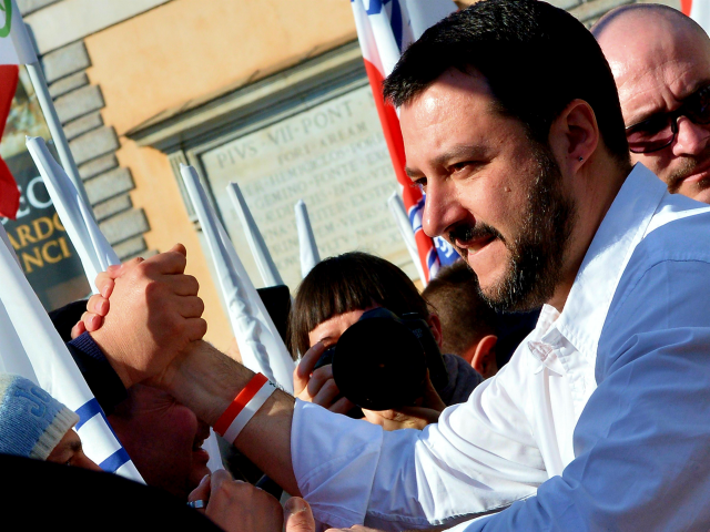 Northern League party leader Matteo Salvini shakes hands during a rally in Rome February 28, 2015. The leader of Italy's right-wing Lega Nord party, Matteo Salvini, held a protest against the policy of Prime Minister Matteo Renzi's government. At the same time, left-wing movements and associations held a 'Mai con …