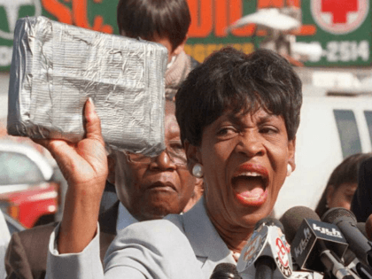 U.S. Representative Maxine Waters holds up a package 07 October similiar to those that she claims held crack cocaine that was sold on the streets of South Central Los Angeles by CIA operatives to finance the Contra rebels in Nicaragua in the 1980's. Waters presented documentation to the press at …