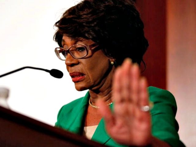Rep. Maxine Waters (D-CA) holds up her hand in an attempt to stop photographers from taking her picture during a news conference she called to challenge the charges made against her by the House of Representatives ethics committee at the U.S. Capitol August 13, 2010 in Washington, DC. The House …