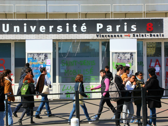 Students stand outside the Paris 8 Saint-Denis university due to a blockade of the buildin