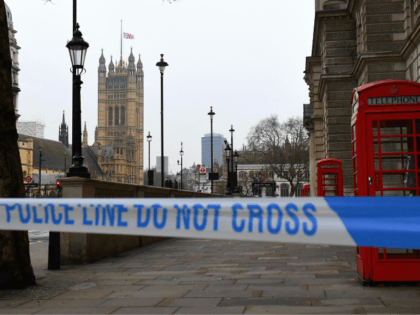 TOPSHOT - A police security cordon remains around the Houses of Parliament on March 23, 20