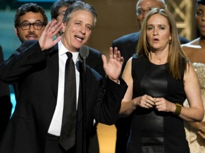 Samantha Bee and Jon Stewart appear onstage at The 2012 Comedy Awards in New York, Saturday, April 28, 2012. (AP Photo/Charles Sykes)