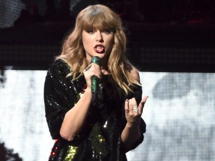 FILE - In this Dec. 8, 2017 file photo, singer Taylor Swift performs at Z100's iHeartRadio Jingle Ball at Madison Square Garden in New York. Swift surprised an 8-year-old girl at the Phoenix hospital where she has been recovering from devastating burns. The Arizona Republic reports the pop star showed …