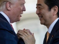 Trump-Abe-hands-face-to-face-ap President Donald Trump welcomes Japanese Prime Minister Shinzo Abe outside the West Wing of the White House in Washington, Friday, Feb. 10, 2017. (AP Photo/Andrew Harnik)