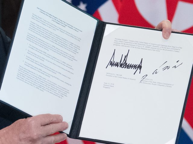 Trump Kim SIngapore document (Saul Loeb / AFP / Getty)