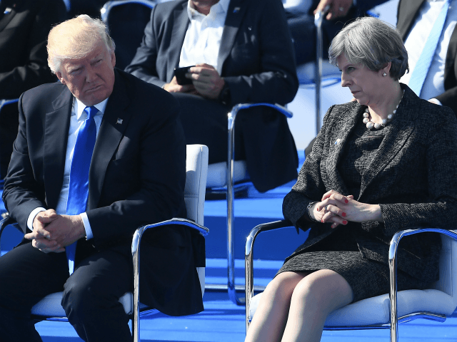 BRUSSELS, BELGIUM - MAY 25: US President Donald Trump (C) and Britain's Prime Minister Theresa May (R) look on during the NATO (North Atlantic Treaty Organization) summit ceremony at the NATO headquarters on May 25, 2017 in Brussels, Belgium.(Photo by Justin Tallis - Pool/Getty Images)