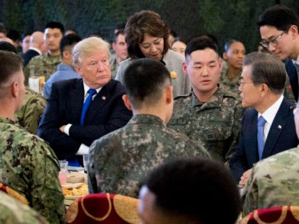 President Donald Trump, left, and South Korean President Moon Jae-in, right, have lunch with U.S. and South Korean troops at Camp Humphreys in Pyeongtaek, South Korea, Tuesday, Nov. 7, 2017. Trump is on a five country trip through Asia traveling to Japan, South Korea, China, Vietnam and the Philippines. (AP …