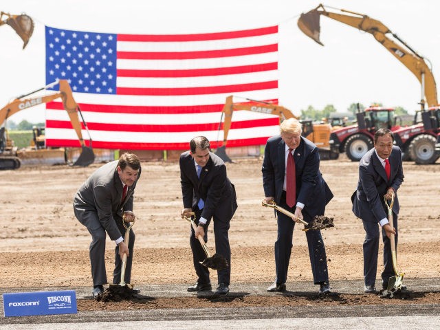 U.S. President Donald Trump (C) breaks ground with Wisconsin Gov. Scott Walker (2nd L), Foxconn CEO Terry Gou (2nd R), U.S. House Speaker Paul Ryan (R-WI) (R) and Christopher “Tank” Murdock (L), the first Wisconsin Foxconn employee, at a ceremony for the Foxconn Technology Group computer screen plant on June …