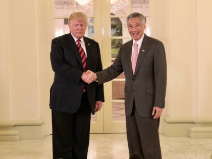 U.S. President Donald Trump (L) meets with Singapore's Prime Minister Lee Hsien Loong (R) to attend a bilateral meeting at the Istana, Singapore on June 11, 2018. (Photo by Ministry of Communications and Information, Republic of Singapore / Handout/Anadolu Agency/Getty Images)