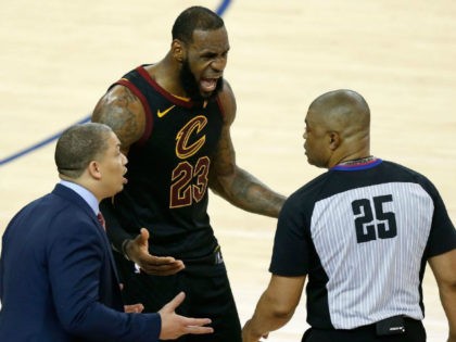 LeBron James and Cleveland Cavaliers coach, Tyronn Lue, react to a call reversal in Game 1 of the 2018 NBA Finals.