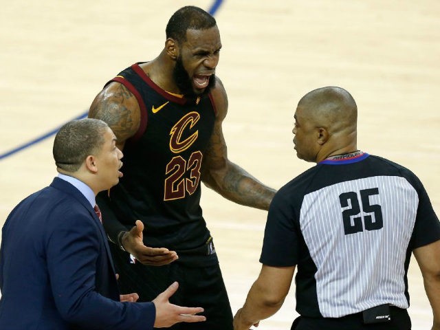 LeBron James and Cleveland Cavaliers coach, Tyronn Lue, react to a call reversal in Game 1