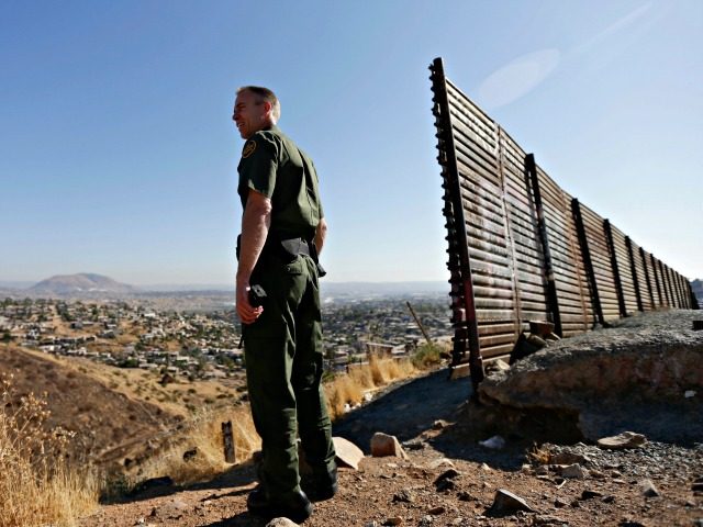 In this June 13, 2013 file photo, US Border Patrol agent Jerry Conlin looks out over Tijua