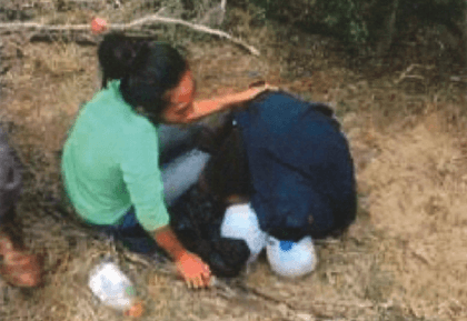 Cindy Vanessa Mendez kneels over her father's body. Omar Mendez Perez died after being left behind by human smugglers after he fell ill and was unable to keep up. (Photo: Brooks County Sheriff's Office)