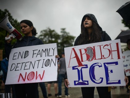 Activists gather outside the White House in response to a call from the American Civil Liberties Union (ACLU) to protest the separation of children from their migrant families at the US-Mexico border, June 22, 2018 in Washington, DC. (Photo by Eric BARADAT / AFP) (Photo credit should read ERIC BARADAT/AFP/Getty …