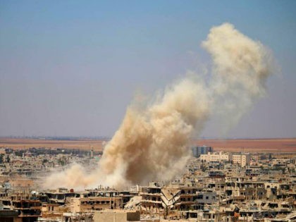 Smoke rises above opposition held areas of Daraa during an airstrike by Syrian regime forces, on June 25, 2018. - Russian-backed regime forces have for weeks been preparing an offensive to retake Syria's south, a strategic zone that borders both Jordan and the Israeli-occupied Golan Heights. (Photo by Mohamad ABAZEED …