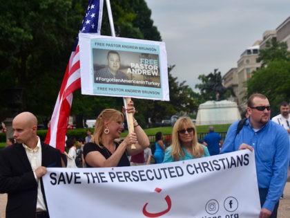 Dede Laugsen of Save the Persecuted Christians (with flag) joined the protest in front of the White House on Wednesday to show support for Andrew Brunson, an American-born pastor who is jailed in Turkey for charges he aided terrorists. (Penny Starr/Breitbart News)