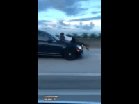 Police: Woman Arrested for Driving with Ex-Boyfriend Clinging to Car's Hood Police: Woman Arrested for Driving with Ex-Boyfriend Clinging to Car's Hood