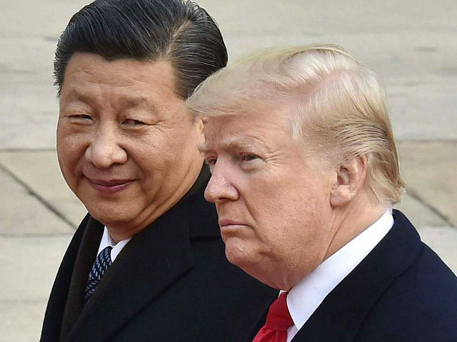 File photo taken in November 2017 shows U.S. President Donald Trump (R) and Chinese President Xi Jinping attending a welcome ceremony in Beijing. Trump announced tariffs on $60 billion of imports from China on March 22, 2018, in response to what he sees as China's unfair trade and investment practices. …