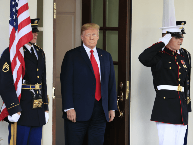 President Donald Trump waits for the arrival of Japanese Prime Minister Shinzo Abe to the