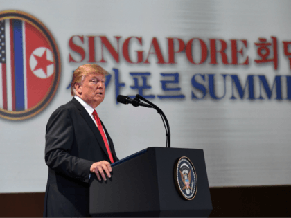 US President Donald Trump speaks at a press conference following the historic US-North Korea summit in Singapore on June 12, 2018. - Donald Trump and Kim Jong Un hailed their historic summit on June 12 as a breakthrough in relations between Cold War foes, but the agreement they produced was …