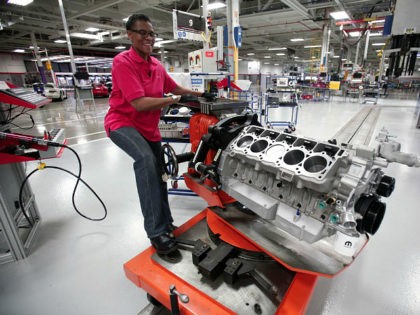 DETROIT, MI - MAY 08: Angella Richberg of Detroit, Michigan handles an engine for a Dodge Viper as it goes through the assembly line at the Viper Assembly Plant May 8, 2015 in Detroit, Michigan. The plant, which makes three Vipers per day, also makes the new 2016 Dodge Viper …