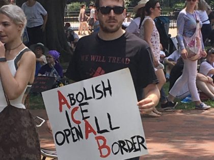 A left-wing protester calling for abolishing ICE and opening up the United States border t
