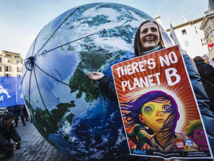 ROME, ITALY - 2015/11/29: Thousands of citizens and environmental activists take part in the 'Global Climate March' to call for tougher action to tackle climate change in Rome. The awareness event took place ahead of the 21st Session of the Conference of the Parties to the United Nations Framework Convention …