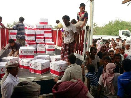 Yemenis drop off boxes of humanitarian aid provided by the Emirati Red Crescent in the coastal town of Mujailis, south of the city of Hodeida, on June 6, 2018. (Photo by NABIL HASSAN / AFP) (Photo credit should read NABIL HASSAN/AFP/Getty Images)