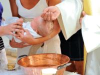 infant baptism A priest baptizes a baby in a church in Tourcoing, northern France, on July 21, 2013. AFP PHOTO PHILIPPE HUGUEN / AFP PHOTO / PHILIPPE HUGUEN (Photo credit should read PHILIPPE HUGUEN/AFP/Getty Images)