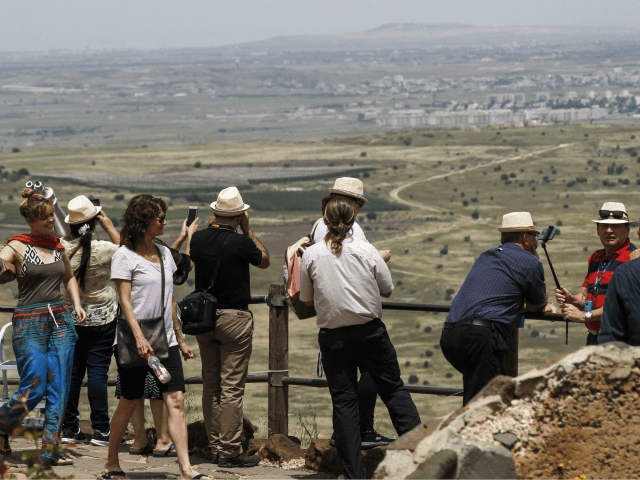 Tourists visit an Israeli army post on Mount Bental in the Israeli-annexed Golan Heights o