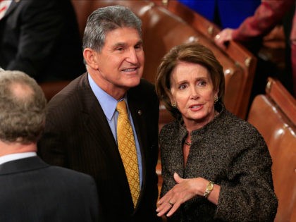 WASHINGTON, DC - JANUARY 20: House Minority Leader Nancy Pelosi (R) (D-CA) talks with Sen. Joe Manchin (L) (D-WV) before the start of the State of the Union speech in the House chamber of the U.S. Capitol January 20, 2015 in Washington, DC. U.S. President Barack Obama was expected to …