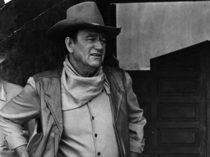 1967: The American film star, John Wayne, with his son, on location in Mexico for the filming of 'War Wagon.' (Photo by Keystone/Getty Images)