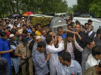 Kashmiri men carry coffin of Shujaat Bukhari, the slain editor-in-chief of the Srinagar ba