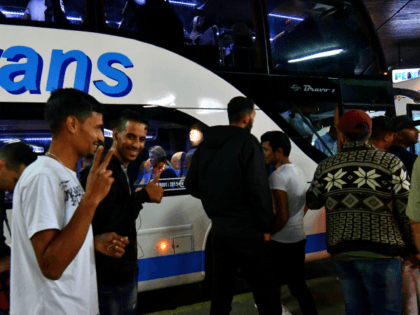 Migrants board a night bus, on their way to North-Western Bosnian town of Bihac, late on J