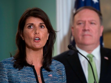 US Secretary of State Mike Pompeo looks on as US Ambassador to the United Nation Nikki Haley speaks at the US Department of State in Washington DC on June 19, 2018. - The United States announced that it is withdrawing from the UN Human Rights Council. (Photo by Andrew CABALLERO-REYNOLDS …