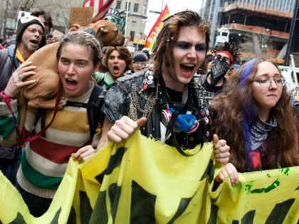 Occupy Wall Street demonstrators march near Zuccotti Park on Saturday, March 17, 2012, in New York. With the city's attention focused on the huge St. Patrick's Day Parade many blocks uptown, the Occupy rally at Zuccotti Park on Saturday drew a far smaller crowd than the demonstrations seen in the …