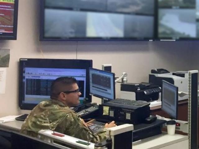 Texas National Guardsman Sgt. Javier Olmos monitors the Rio Grande River border near Eagle
