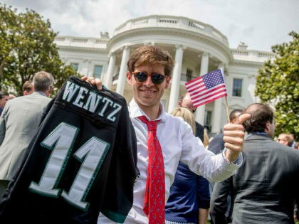 Tim Dagit of Chester Springs, Pa. holds up an Philadelphia Eagles jersey for quarterback C