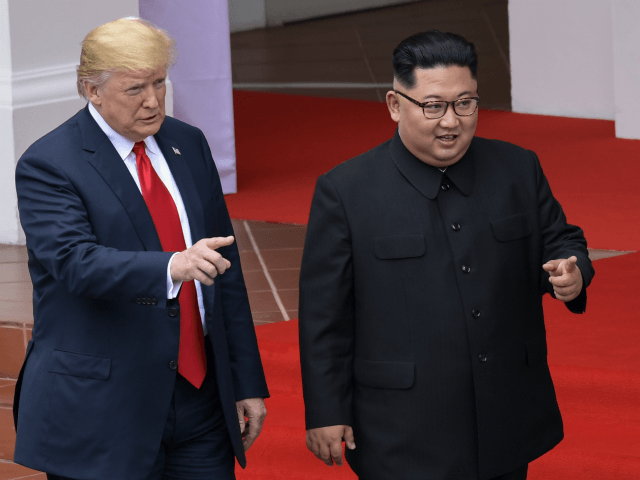 US President Donald Trump and North Korea leader Kim Jong Un walk from lunch at the Capell