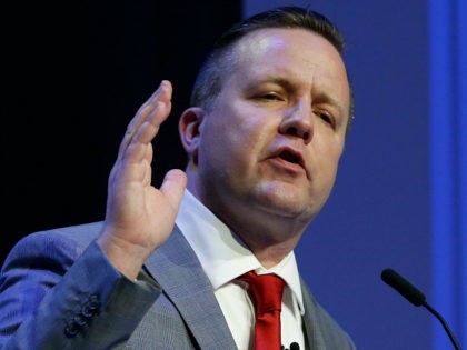 Republican primary senatorial candidate Corey Stewart gestures during a debate with E. W.