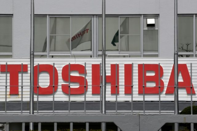 Toshiba completes $21 bn sale of chip unit