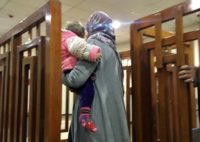 This file photo taken on February 19, 2018, shows French citizen Melina Boughedir carrying her son as she arrives to court in the Iraqi capital Baghdad where on June 3, 2018 she was sentenced to life in jail for membership of the Islamic State group Iraq court sentences French woman to life for IS membership: AFP