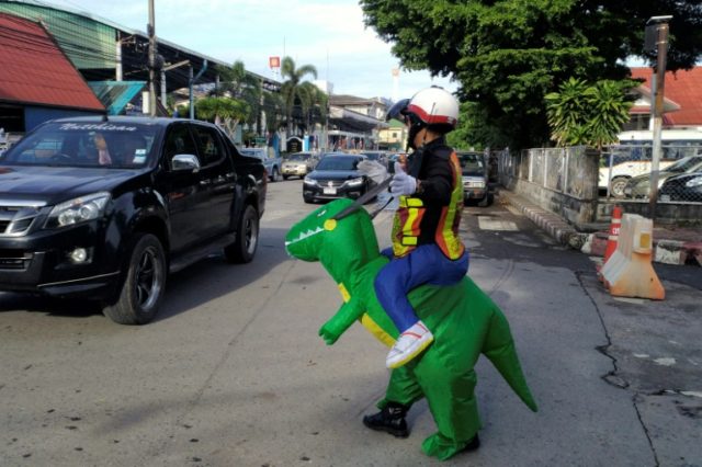 Doyouthinkhesaurus: Thai 'T-Rex' cop gives traffic safety lessons