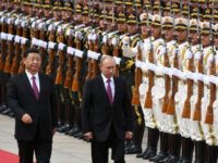 Russia's President Vladimir Putin reviews a military honour guard with Chinese counterpart Xi Jinping during a welcoming ceremony outside the Great Hall of the People in Beijing Russia's President Vladimir Putin reviews a military honour guard with Chinese counterpart Xi Jinping during a welcoming ceremony outside the Great Hall of the People in Beijing