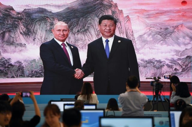 As G7 feuds, Xi and Putin play up their own club