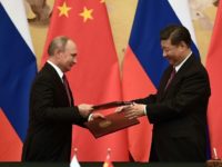 Putin dismisses G7 criticism as 'babbling', calls for cooperation